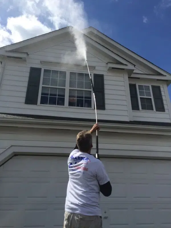 professional-power-washing-house-before-painting.jpg.webp