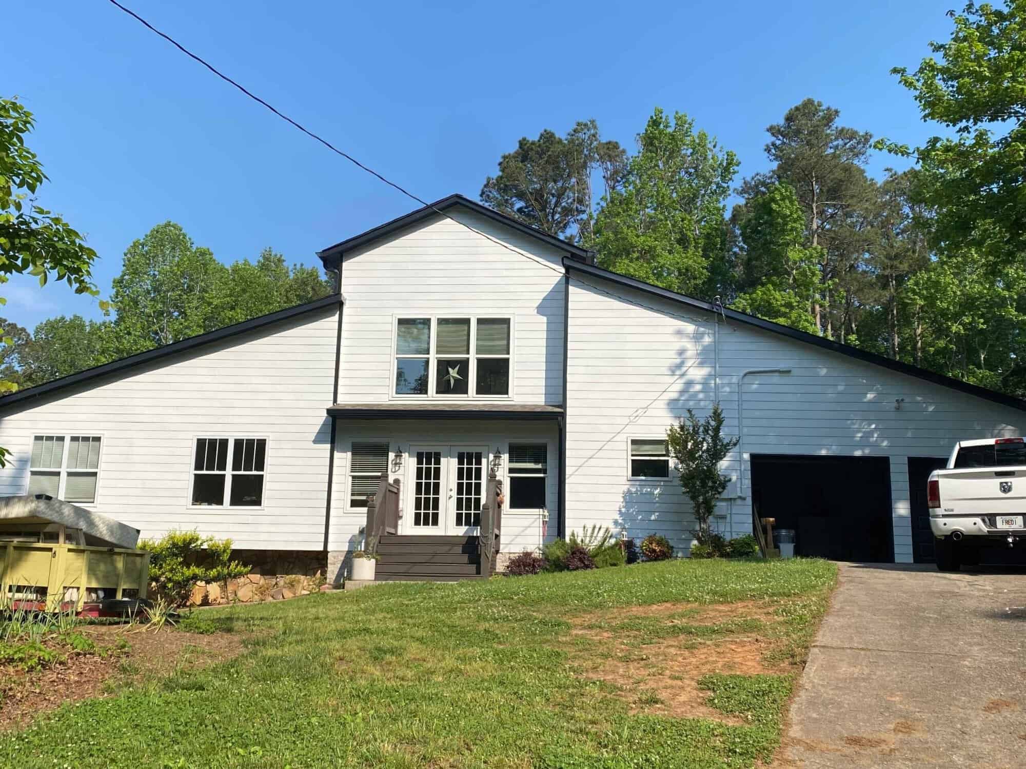 white farmhouse with new paint exterior