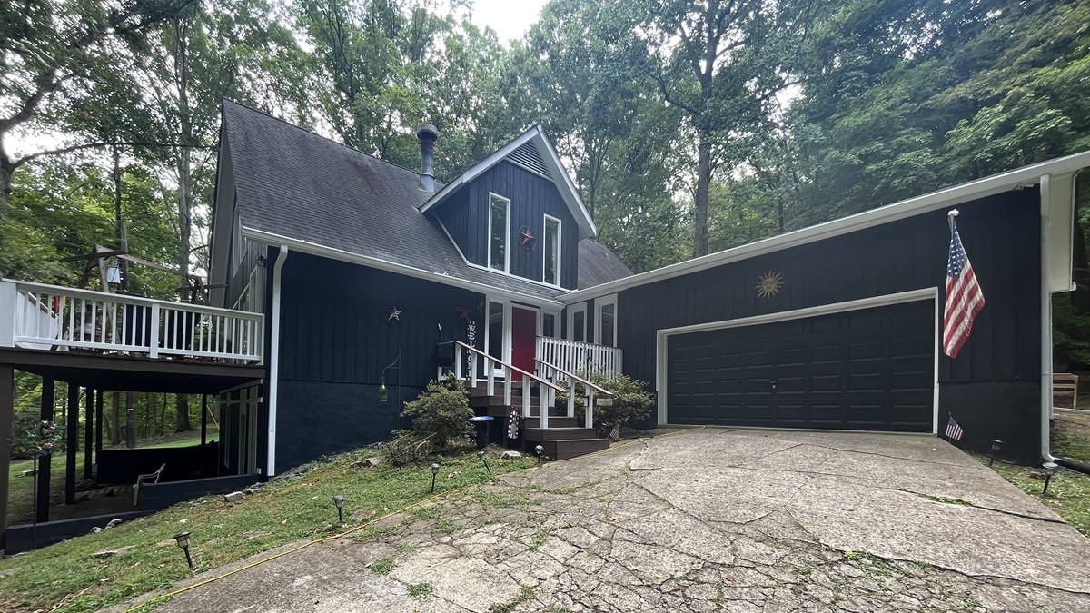 Expert multi-surface exterior painting in Brentwood, TN transforms a wooded home with custom colors, durable prep, and standout curb appeal.