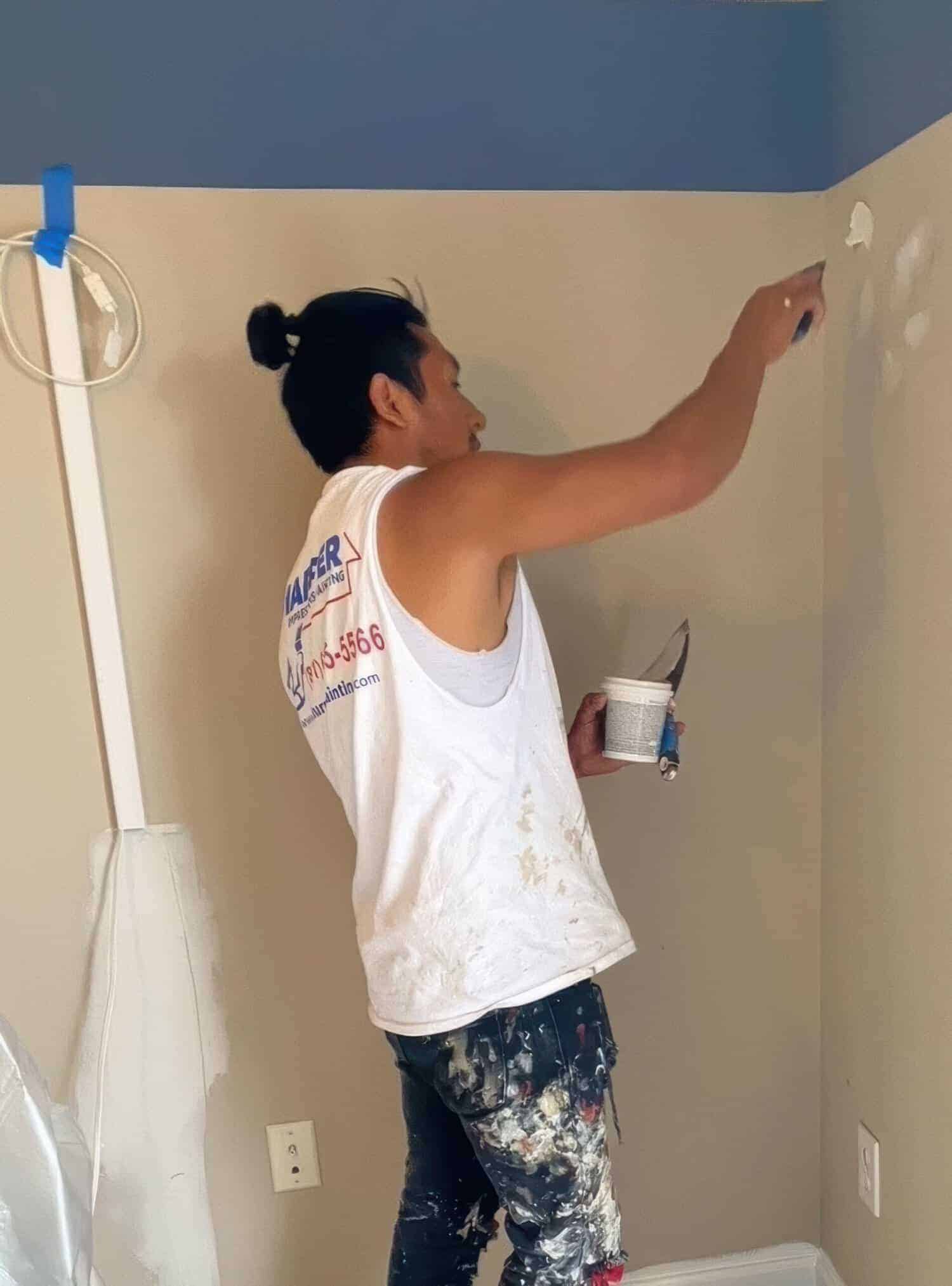 a painter painting the wall