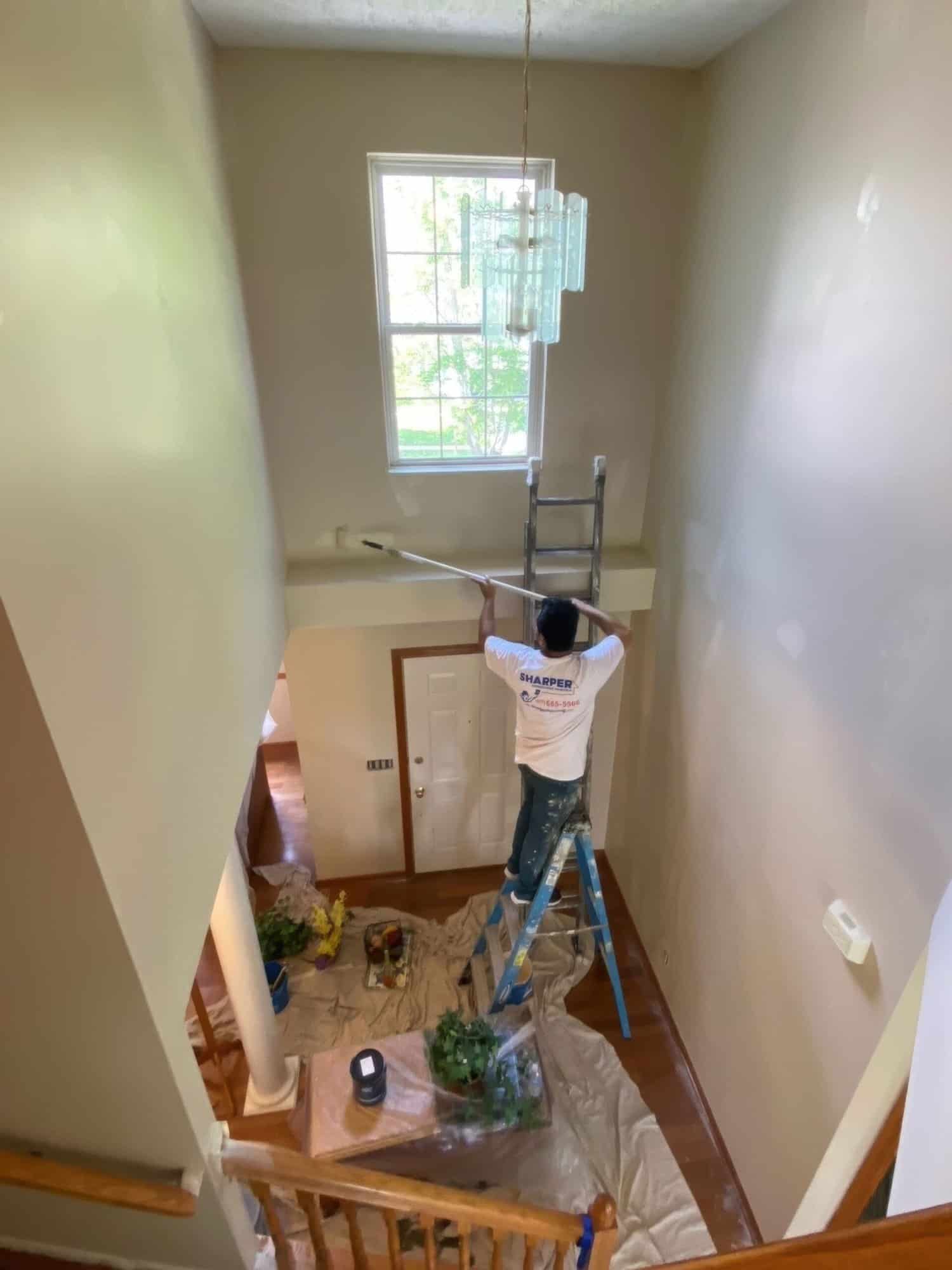 a painter painting the upper floor