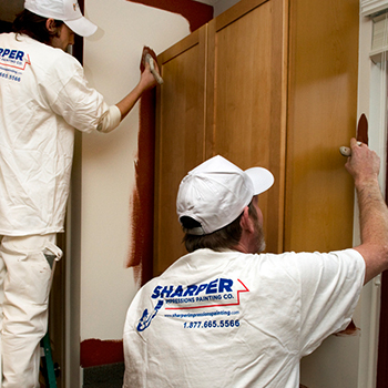 Painters painting the interior of a house