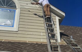 Painters painting the exterior of a house