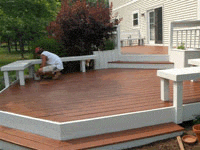 a painter painting the deck