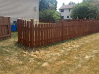 wooden fence surrounding a backyard