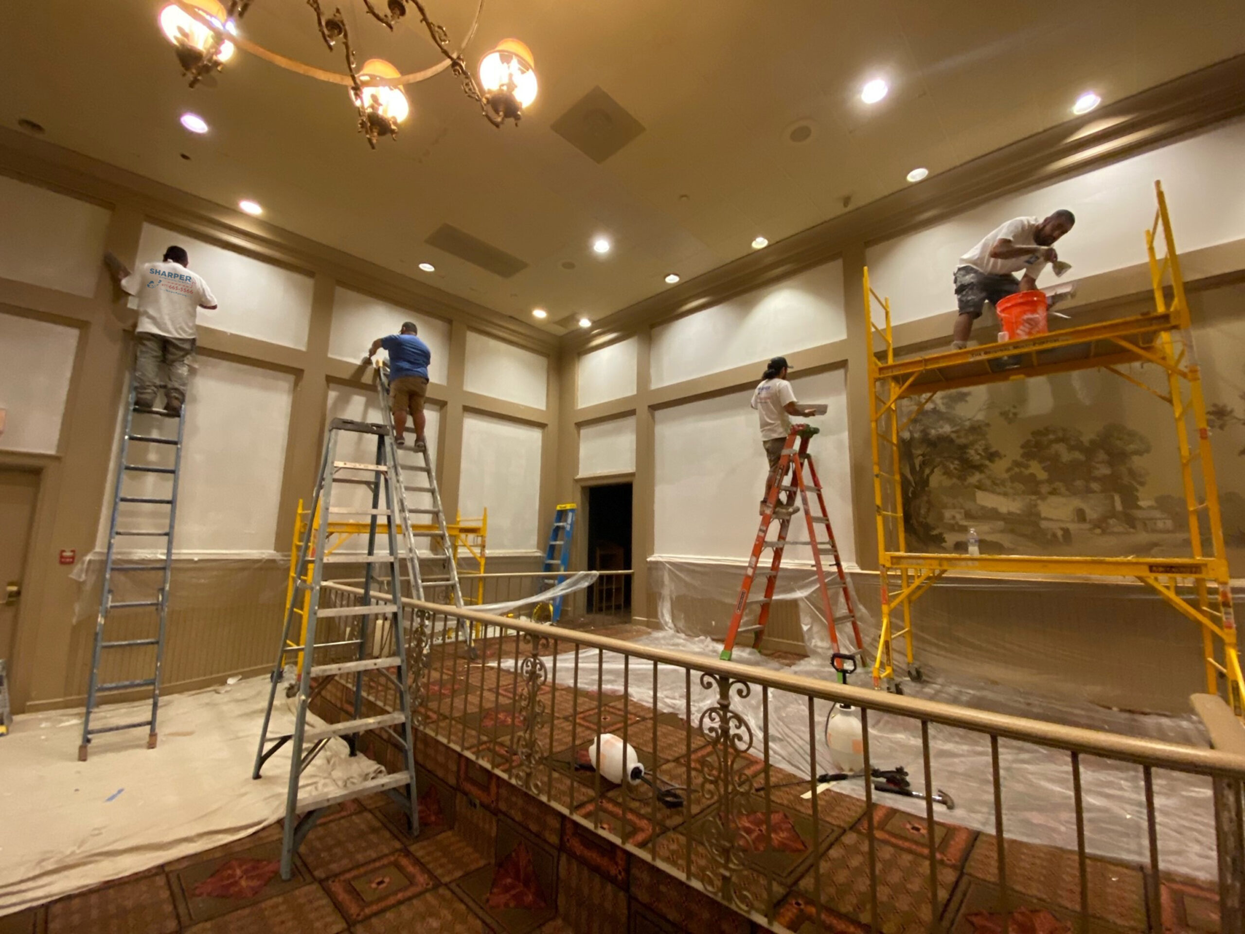 Painters painting the interior of a house